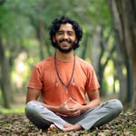 Dr. Jorge A. Fernández sitting outdoors in a calm, meditative posture